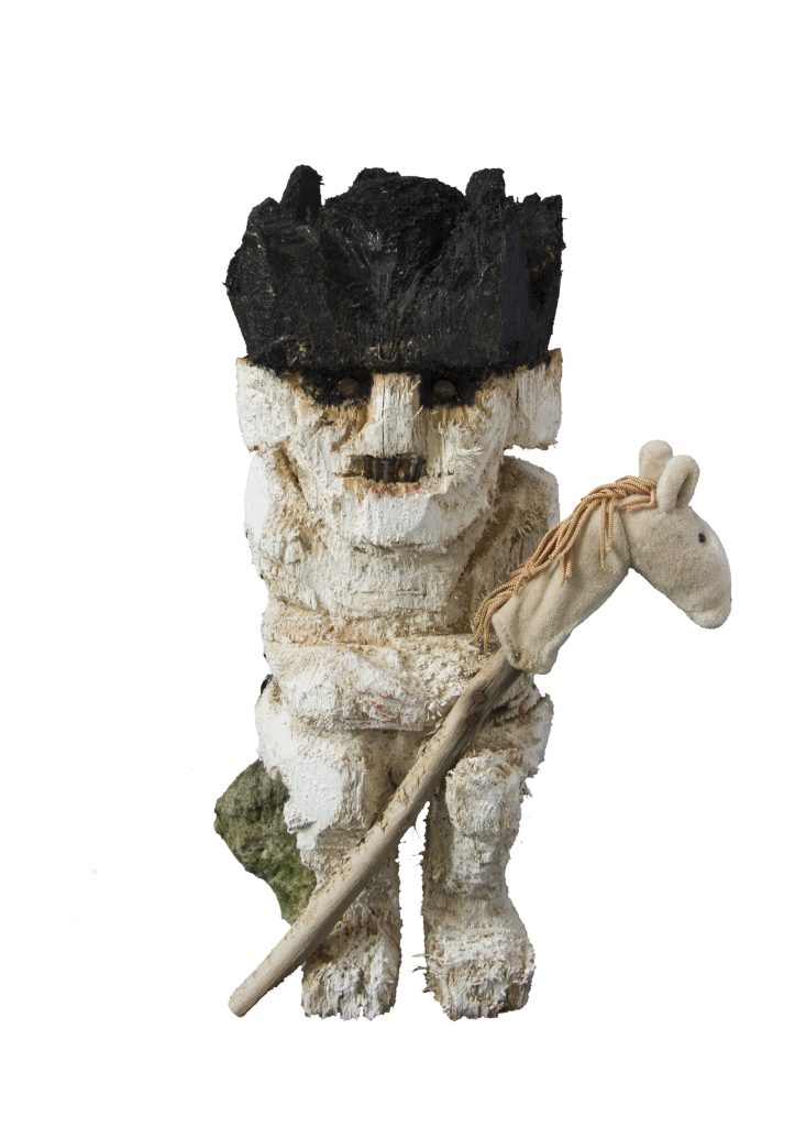 Eine Holzfigur mit einem Steckenpferd in der Hand – Den Stillstand verstehen und emotionale Autonomie zurückgewinnen.